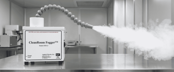 Cleanroom Fogger releasing disinfectant mist across a stainless steel surface in a controlled laboratory environment