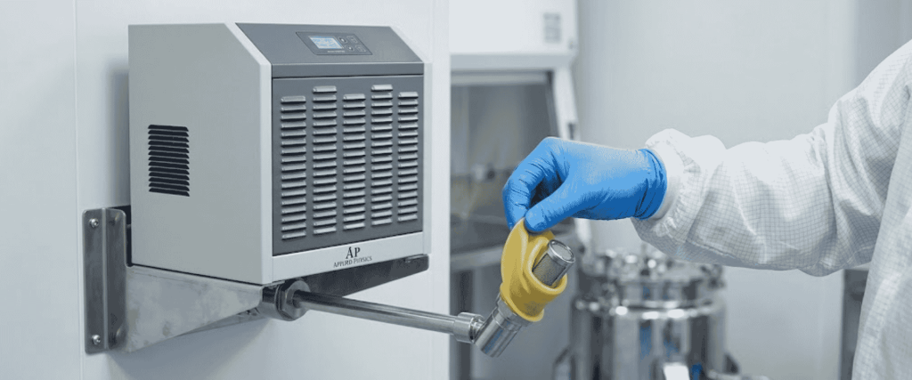 Humidity Sensor mounted on a clean room wall, held by a gloved technician during inspection