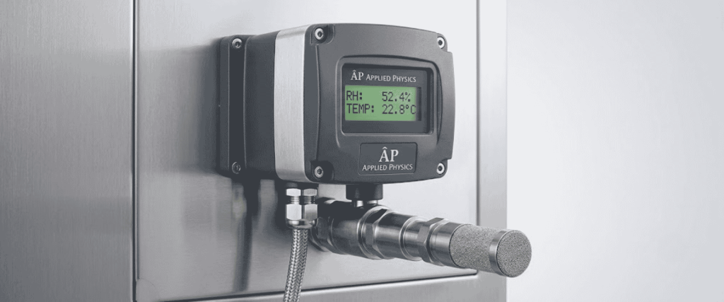 Humidity Sensor on stainless steel panel displaying RH 52.4% and temperature 22.8°C with probe attached