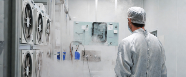 Cleanroom Fogger used in a sterile facility as a technician disinfects equipment inside a controlled cleanroom environment
