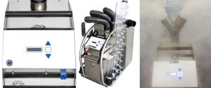 Low fog machine with dual nozzles emitting dense white fog over a stainless-steel control box with illuminated display. 