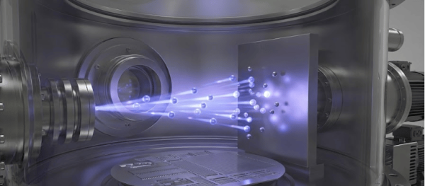 High-tech vacuum chamber with a focused blue ion/particle beam striking a target wafer, surrounded by metal components and motors
