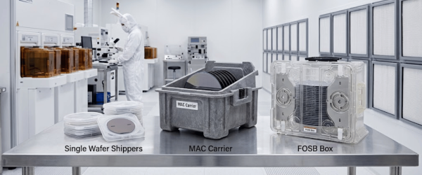 Cleanroom technician in full PPE inspects semiconductor wafers and carriers on a stainless table labeled Single Wafer Shippers, MAC Carrier, and FOSB Box