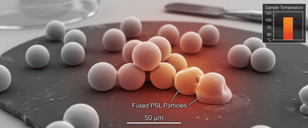 Cluster of spherical polymer particles on a flat substrate, several fused and heat‑softened in the center, labeled Fused PSL Particles, scale 50 µm
