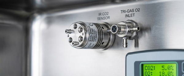 Laboratory Incubator control panel with IR CO2 sensor and gas inlet mounted on stainless steel interior, digital display showing gas levels