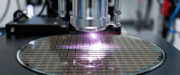 Particle laser processing semiconductor wafer in a clean lab, precision microfabrication equipment working on chip surface