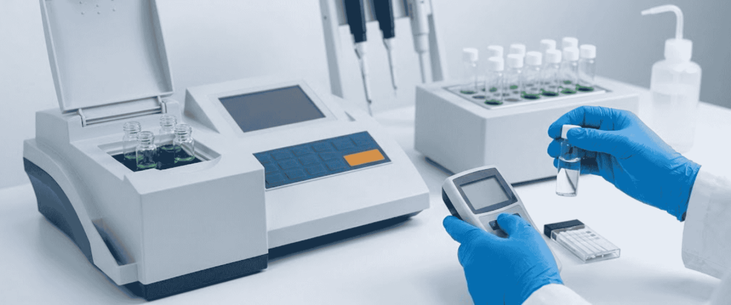 Chloride Interference in COD Testing with lab technician using analyzer, handheld meter, and sample vials in a lab setup