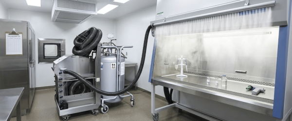 Sterile lab workspace with containment hood and stainless equipment, AP35 aerosol control unit connected for safe sample handling and testing