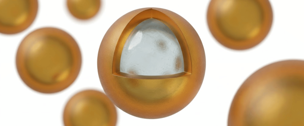 Nanoparticle Coatings on spherical particles, showing a gold-coated surface and transparent core for material protection