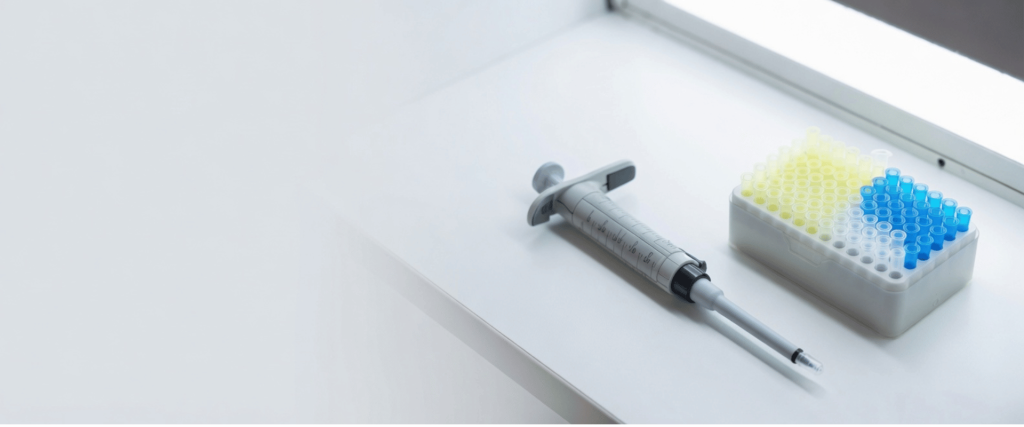 Fixed-Volume Pipettes beside a rack of microcentrifuge tubes on a clean lab bench for precise liquid handling