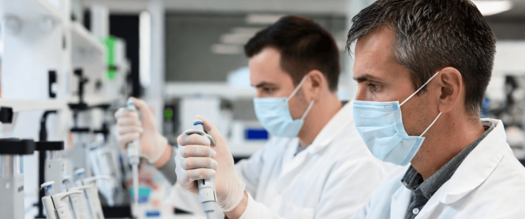 Fixed-Volume Pipettes used by lab technicians for precise liquid handling in a modern medical research laboratory