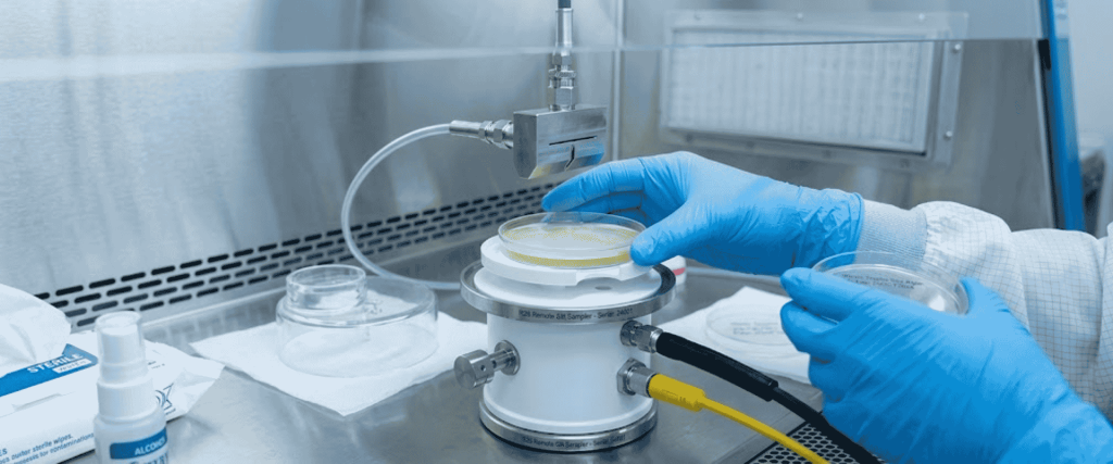 R2S Sampler collecting microbial air samples in a cleanroom using slit sampling technology for contamination monitoring and control.
