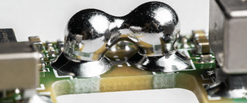 Solder Bridging on a circuit board causing an unwanted connection between solder joints on electronic components