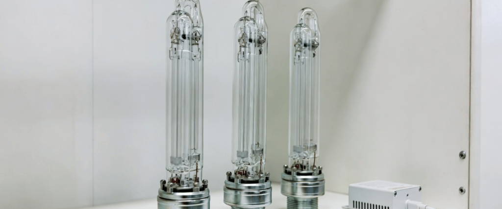 UV Electronic industrial lamps displayed with control unit in a clean white testing chamber